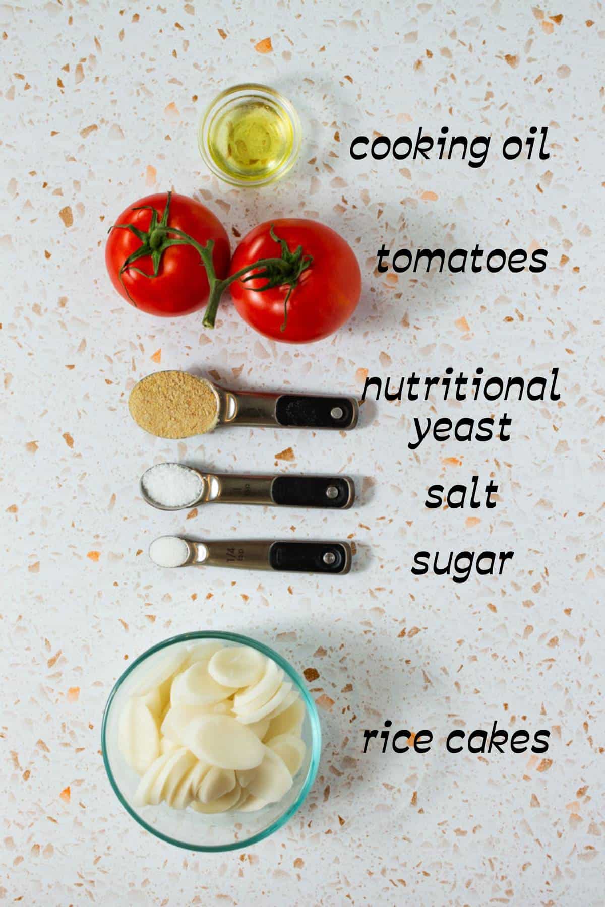 The Ingredients Needed to Make Tomato Rice Cake Soup Laid Out on the Countertop